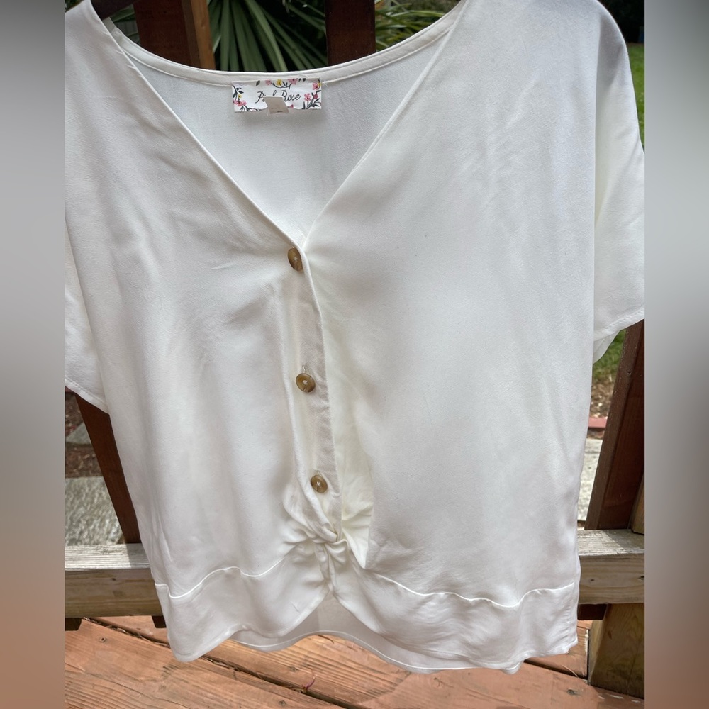Blouse with tied front.